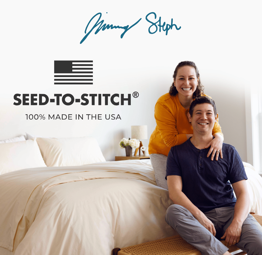 Picture of co-founders Steph & Jimmy sitting on a bed. All Authenticity50 products are 100% made in the USA from Seed-to-Stitch®.