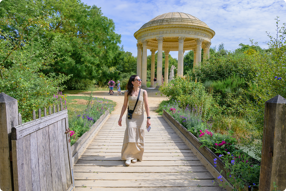 Woman walking in a sunny garden